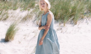 Women in beach wearing linen dress