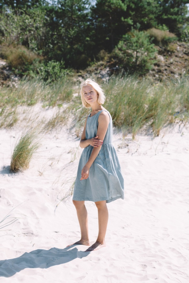 Women in beach wearing linen dress