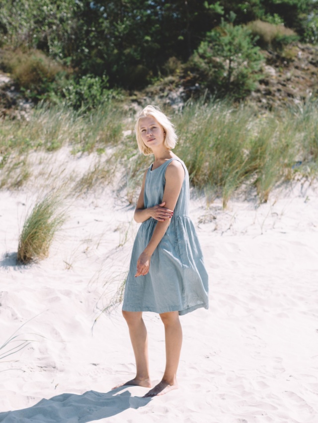 Women in beach wearing linen dress