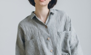 A model wearing linen grey stripe oversized shirt