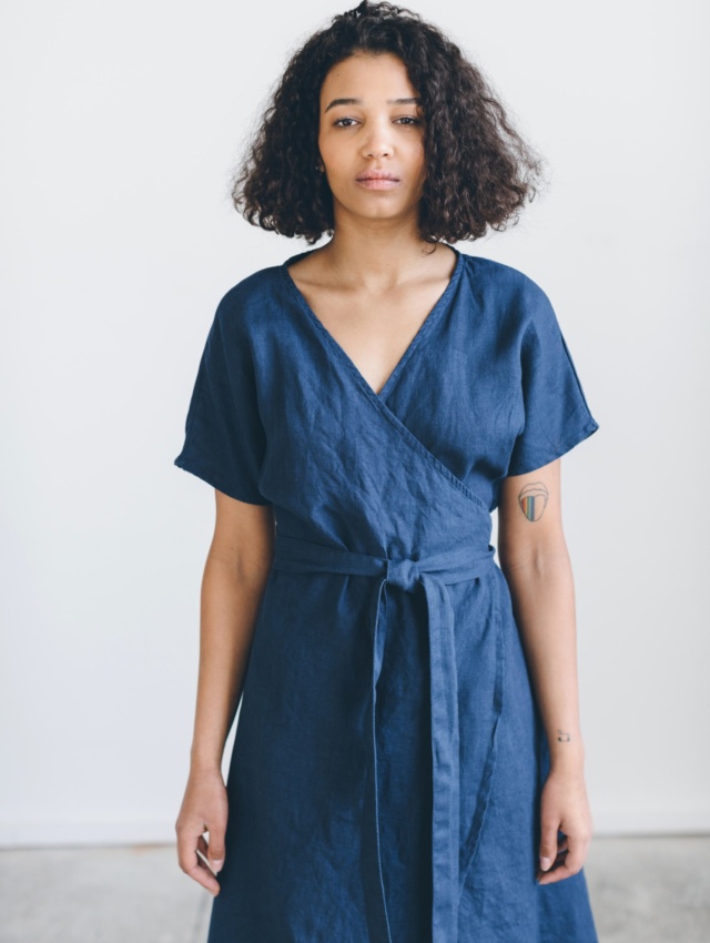 A woman wearing blue wrap dress in linen