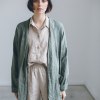 Model wearing relaxed outfit made of linen