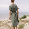 the back of green linen wrap dress