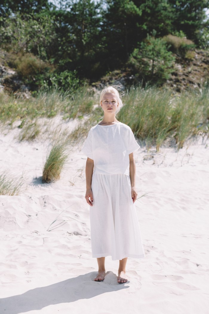 Linenfox model wearing white oversized linen top and matching trousers