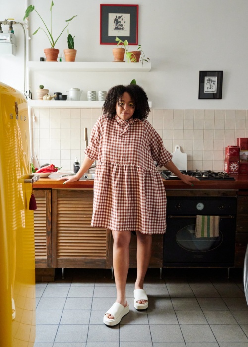 Oversized gingham dress wearing by lady at home