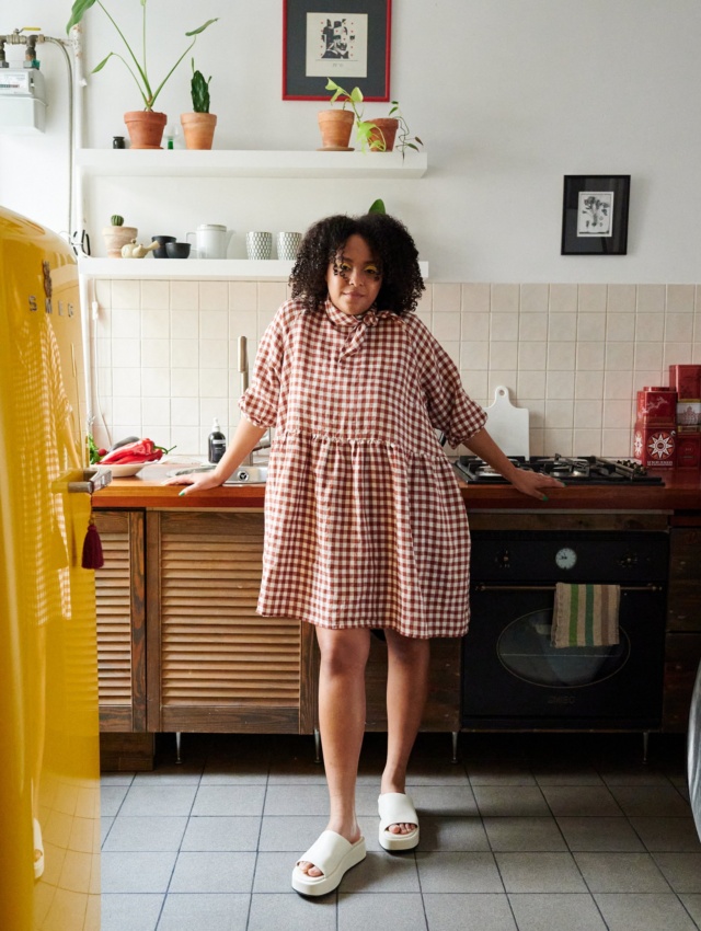 Oversized gingham dress wearing by lady at home