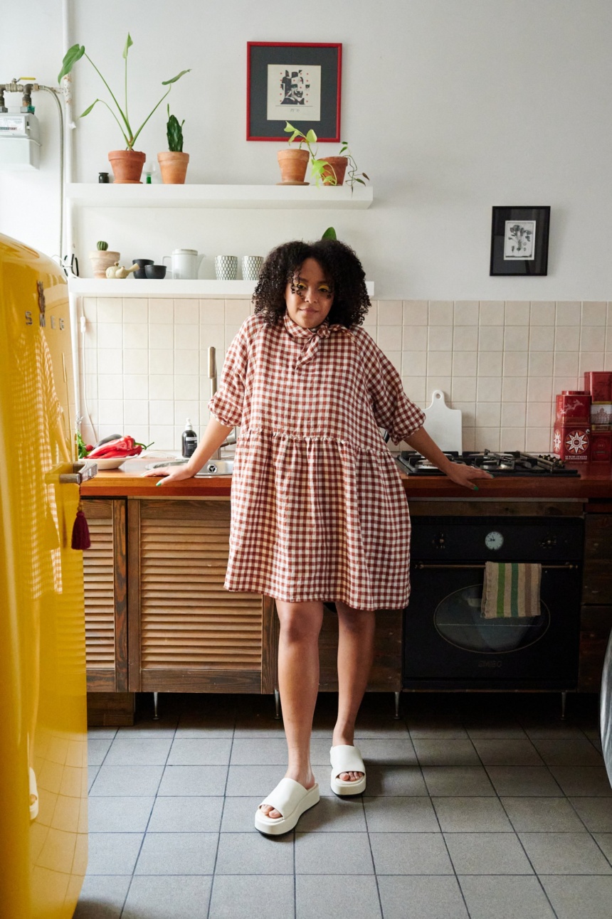 Oversized gingham dress wearing by lady at home