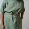 An oversized linen dress with wide sleeves and a belt