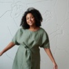 A relaxed fit linen dress with dropped shoulders and wide sleeves