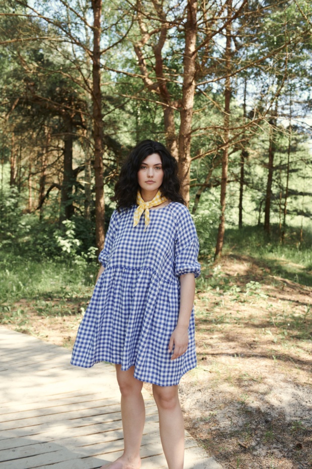 Women in nature wearing oversized raglan dress