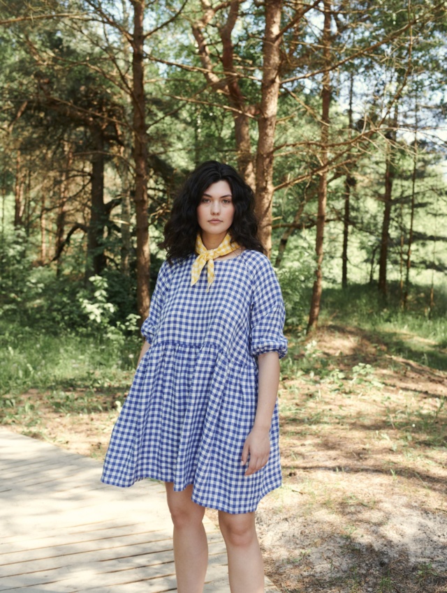 Women in nature wearing oversized raglan dress