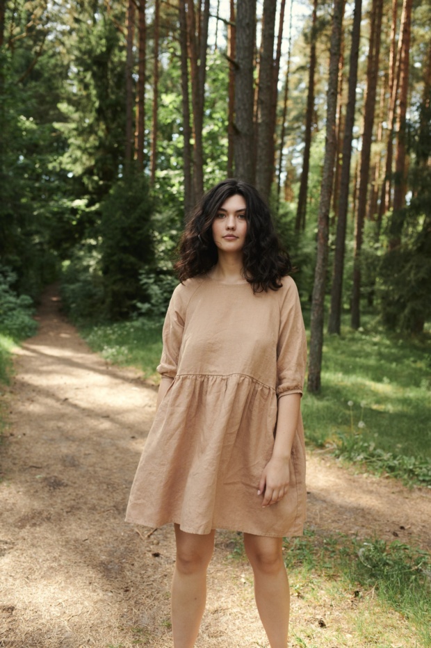 Women in nature wearing nice raglan dress