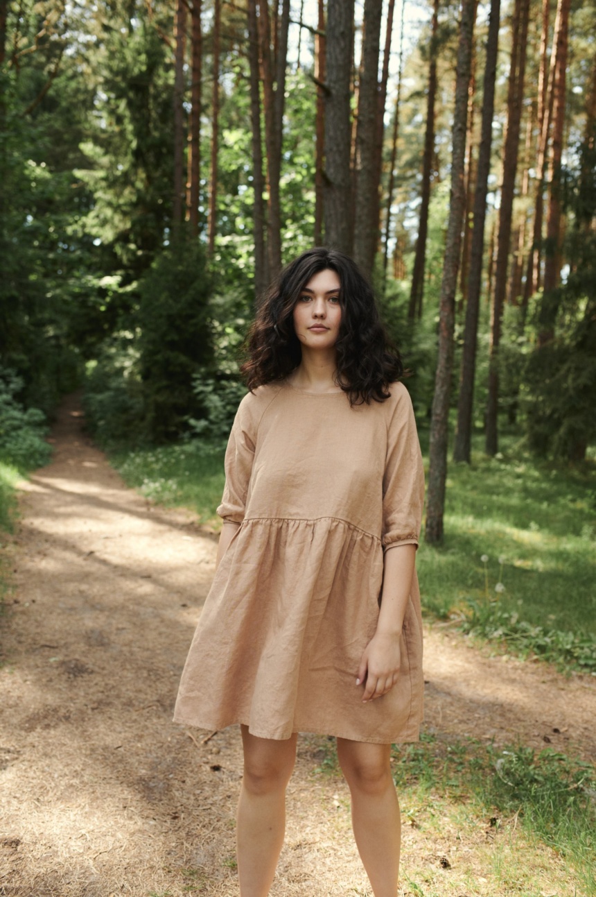 Women in nature wearing nice raglan dress