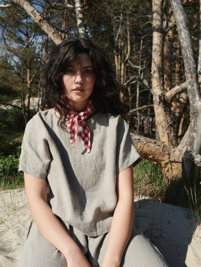 A woman wearing straight cut linen top in natural grey