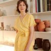 Yellow gingham dress on a woman