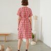 back of red gingham wrap dress in linen