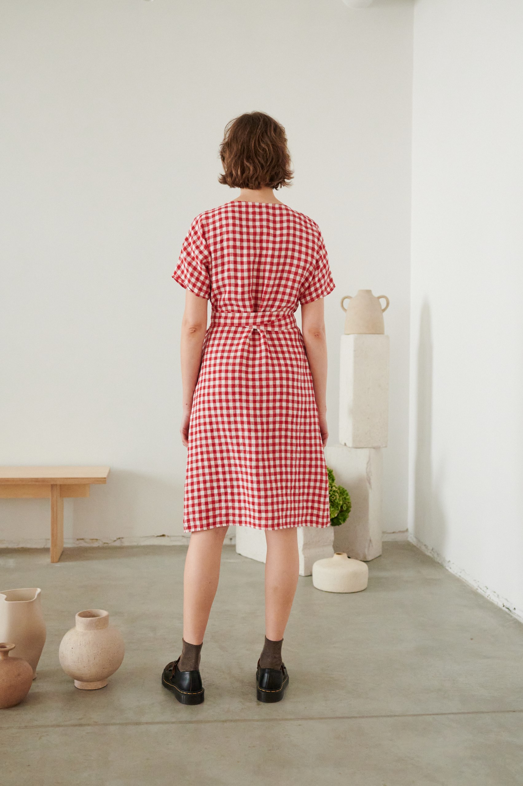back of red gingham wrap dress in linen