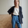 model wearing linen shirt and utility linen trousers