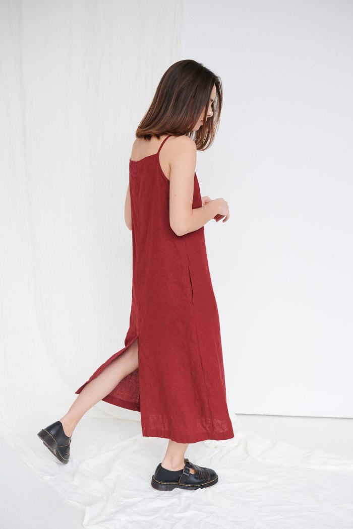 Maxi length linen dress with spaghetti sleeves and pockets
