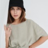 Model with linen dress and bucket hat