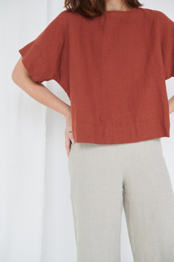 A lady in boxy oversized linen top
