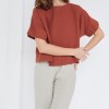 A model in short sleeve boxy linen top
