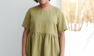 Women wearing roomy smock dress made of linen