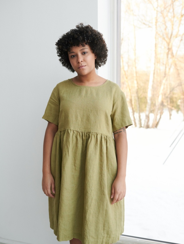 Women wearing roomy smock dress made of linen