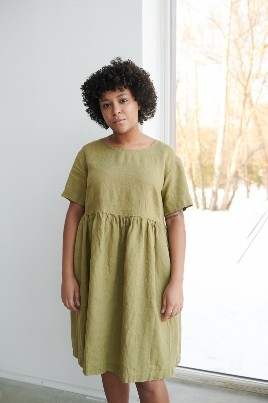 Women wearing roomy smock dress made of linen