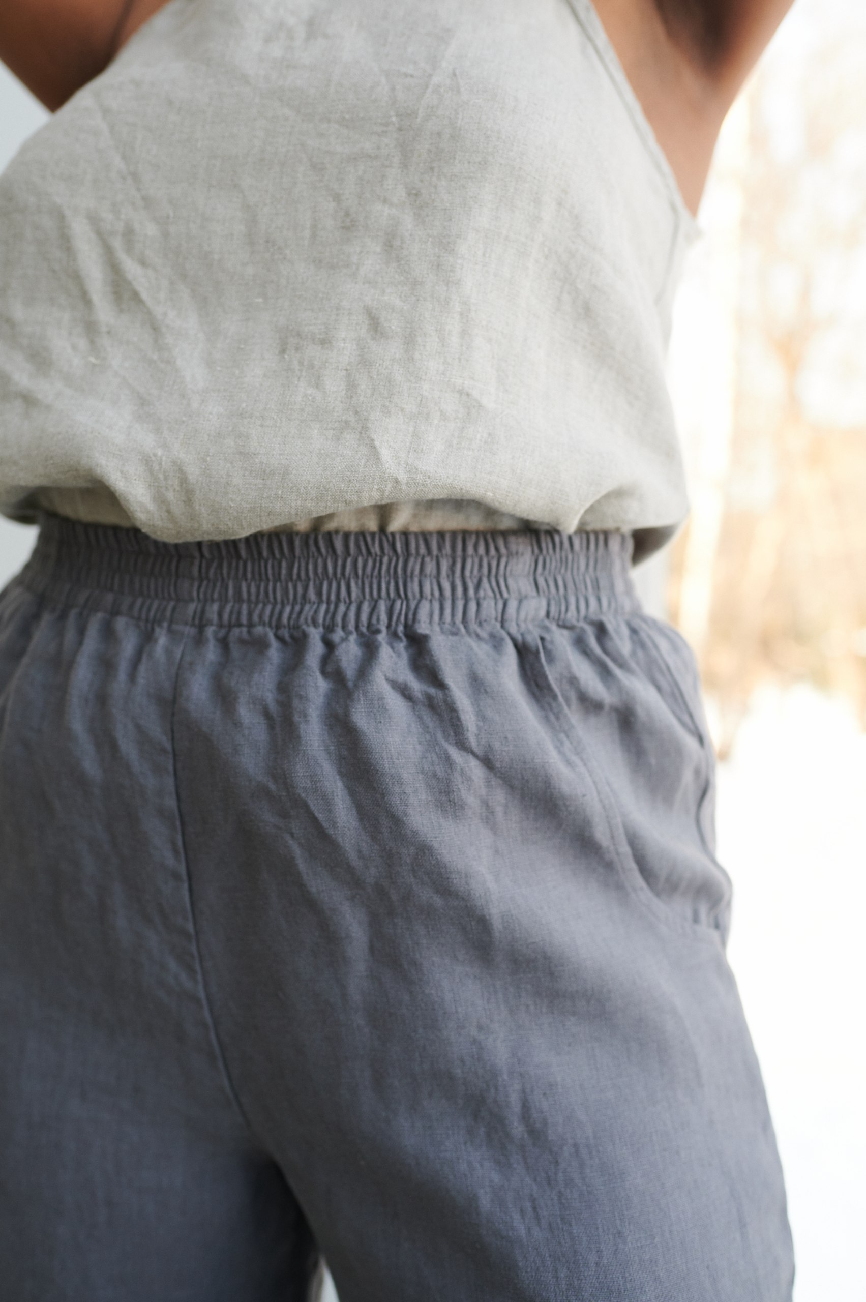 Elastic waistband of natural linen trousers in graphite grey