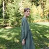 Linenfox model in long sleeve smock dress in green