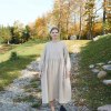 Linenfox model wearing beige linen smock dress