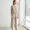 A woman in wide leg trousers from natural linen