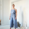 Linenfox model standing in wide leg linen trousers and a matching top
