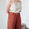 The waistband of brown heavy linen trousers
