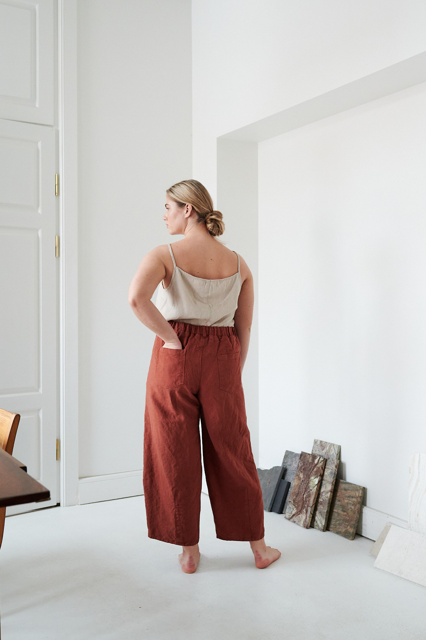 The back of brown high waisted trousers in heavy linen
