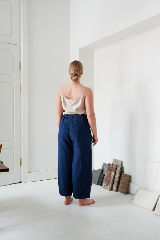 The back of navy blue barrel trousers in heavy linen