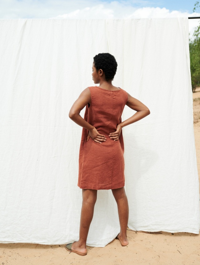 Women wearing sleeveless loose dress in terracotta