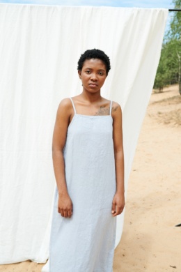 Woman in long summer dress made of linen