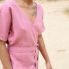 Torso of a pink linen wrap dress