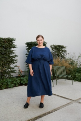 Women in garden with blue linen dress