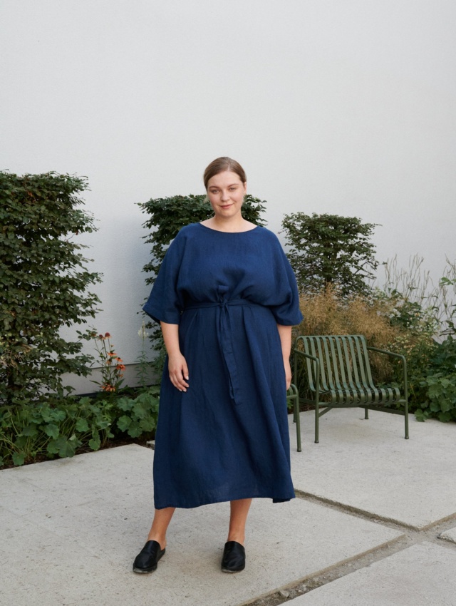 Women in garden with blue linen dress