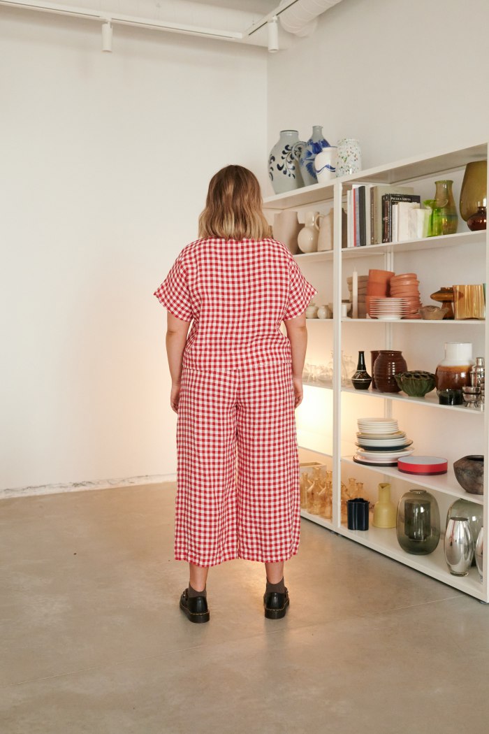 The back of high waisted red gingham linen trousers