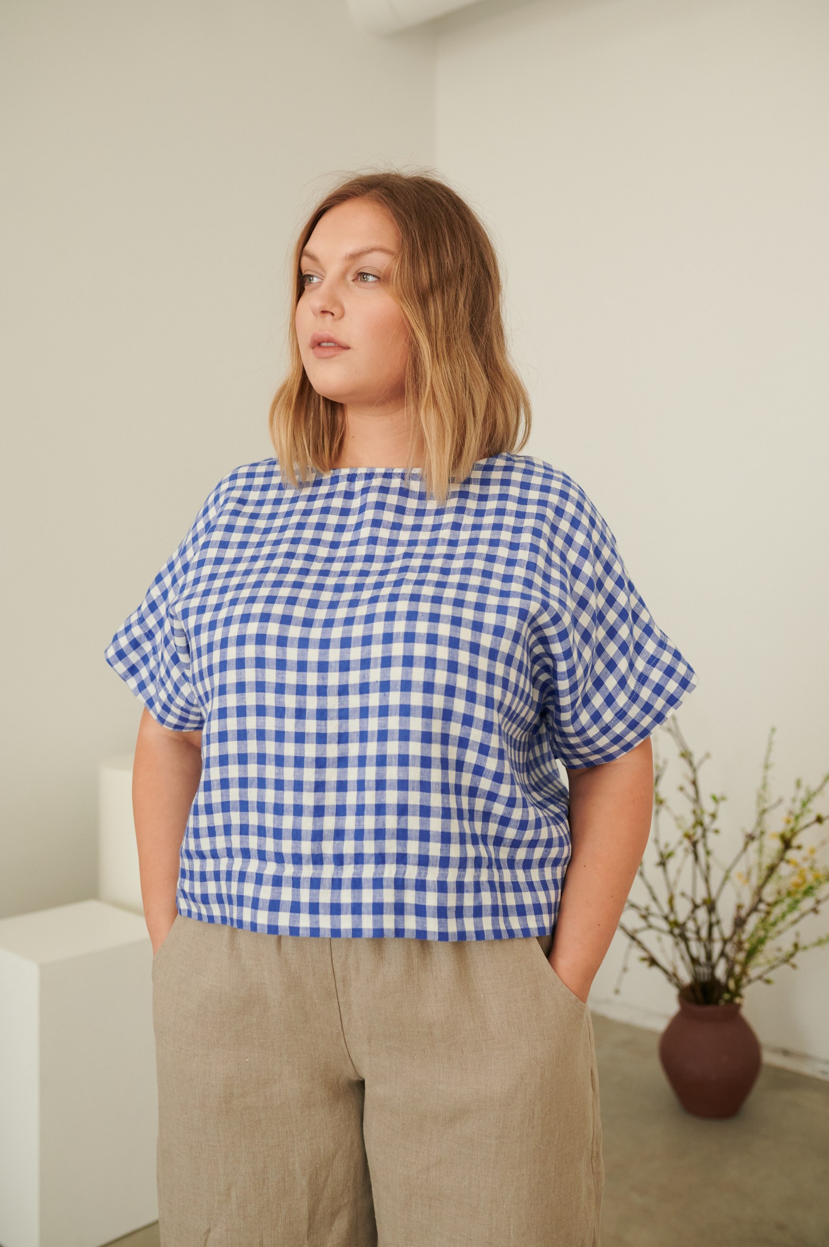 Linenfox model in short sleeve cropped blue gingham linen top