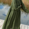 A woman in long oversized green linen dress