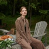 A woman in matching brown heavy linen trousers and a shirt