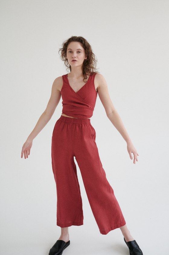 Linenfox model in a sleeveless wrap linen top and matching wide-leg trousers outfit