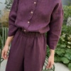 A line jumpsuit with wooden button, elasticated waistband, and slightly cropped sleeves