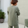 Back of a relaxed fit green heavy linen jacket