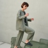 A green heavy linen jacket and matching linen trousers outfit